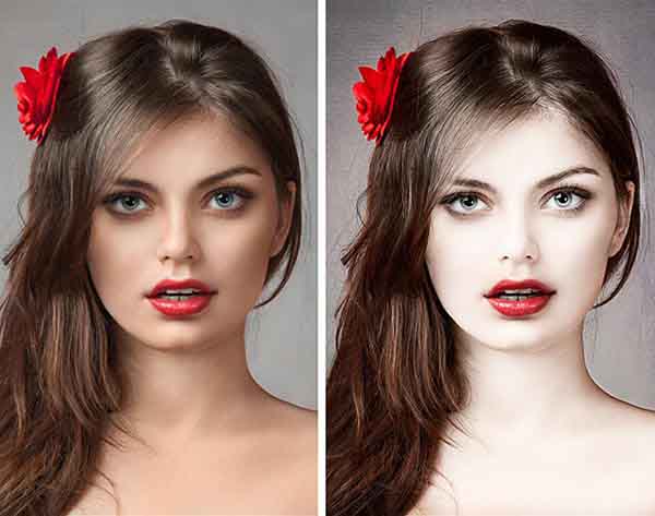 Face of sexy young girl with red flower in hair